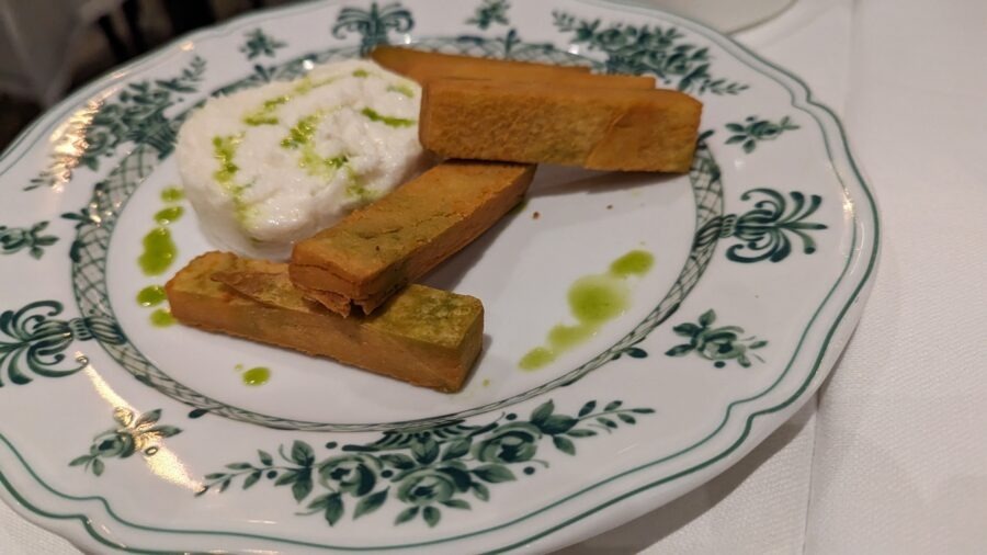 Plate with food and sauce.