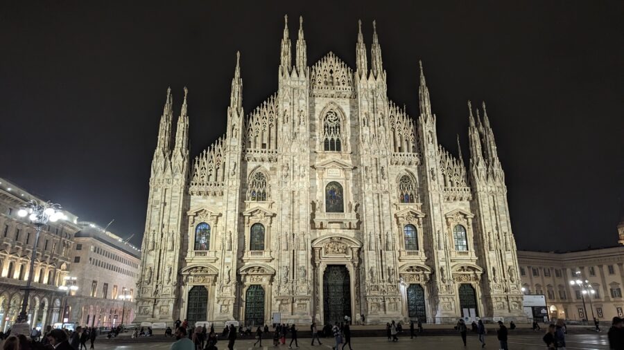 Gothic cathedral illuminated at night.