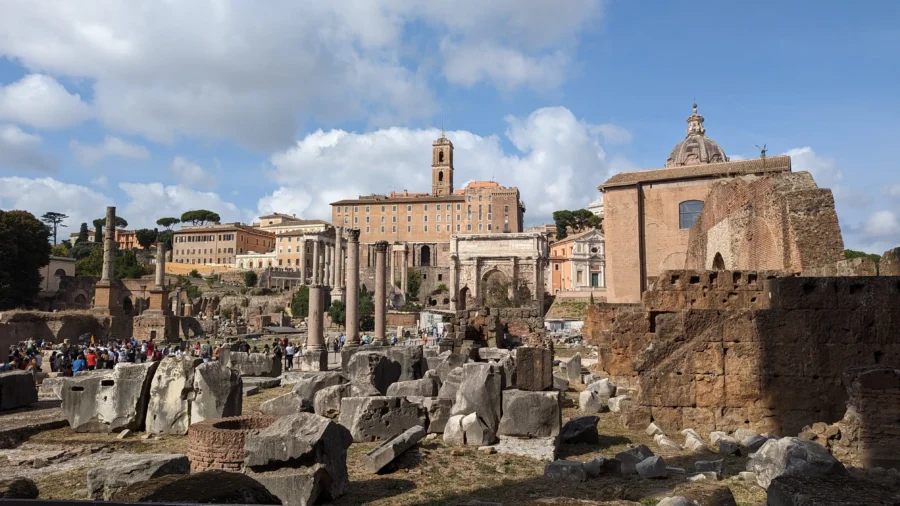 Rome Destination Guide: How to roam when in Rome 3 Ancient ruins under a cloudy sky within the Roman Forum